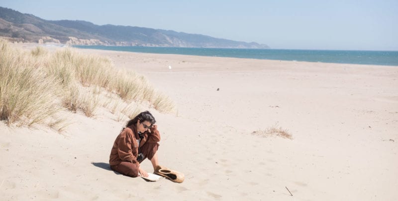 Woman on the beach reading