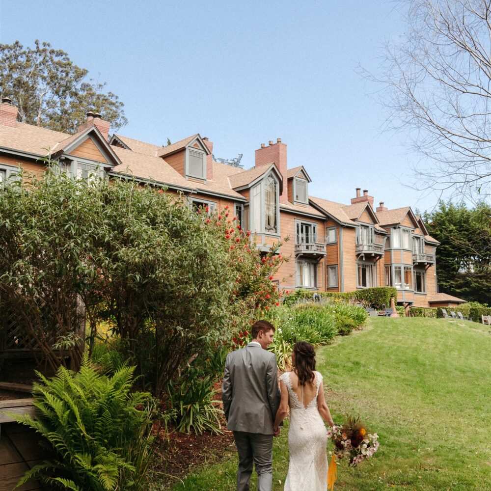 Bride and groom on the back lawn at Olema House