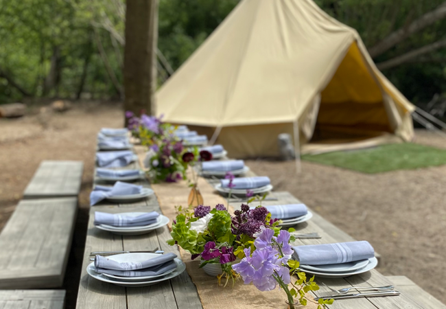 Tent and set picnic table Streamside