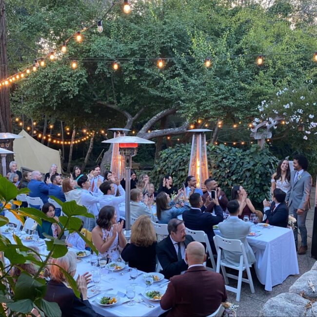 Olema House Wedding Creekside dining under string lights with heaters